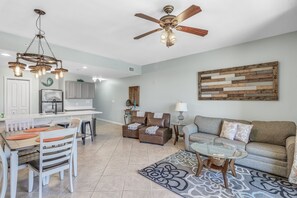 Living Room includes queen sleeper sofa and two single futon chairs.