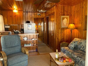 Comfy sofa and recliner in living area.