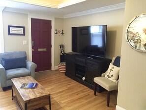 Looking back towards the front door.  Enjoy the 65" Ultra HD TV.