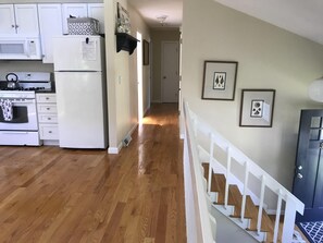 kitchen area leading to 3 bedrooms 