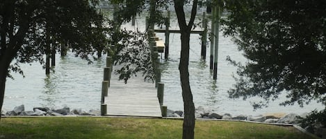 View of the water and pier from 2nd floor deck on house.