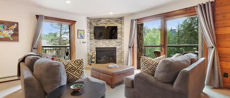 Bright & sunny living room with balcony to enjoy your morning coffee.