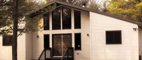 Walk through the double doors of the White Rabbit Cottage single family home