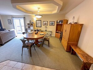 Open area dining, front room, door to deck. 