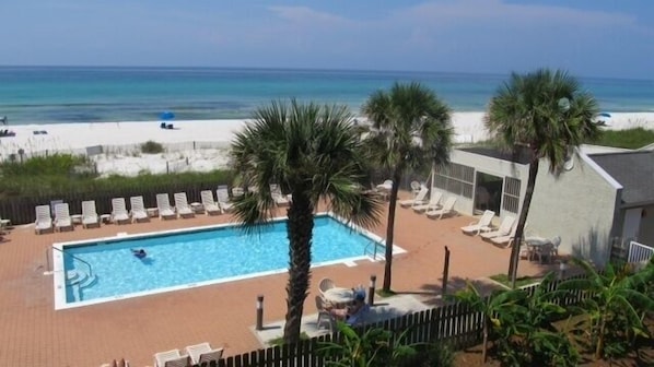 View of pool and beach from the upstairs balcony all within steps of each other!