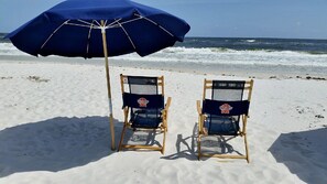 Reserved beach chairs with umbrella waiting for you!