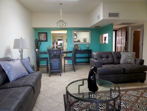 Living room and dining area. Counter top table with 4 chairs