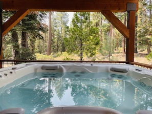 Awe, new hot tub to melt away the days worries as you watch the forest.
