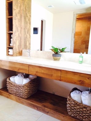 Spacious dual sink vanity and walk in shower