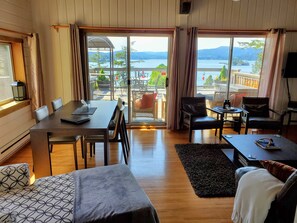 There is also a table in the living room with a view.  And a chaise to relax in