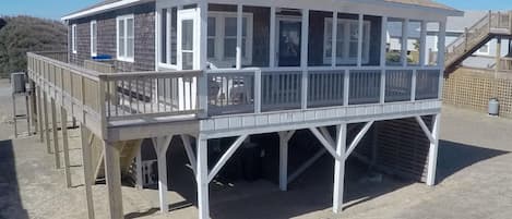 The screened-in porch faces the ocean - relax and enjoy the breezes and view!