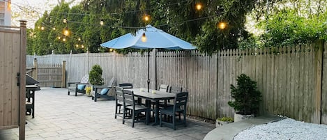 1000 sq ft patio,  fenced. Plenty of seating. Hot & cold outdoor shower.