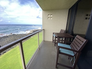 Southwest-facing view where the sun sets. Counter height table and chairs.