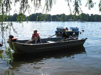 14-foot flat bottom boat with electric motor, charger and two batteries included