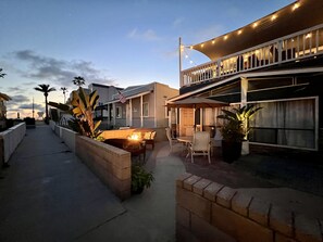 View from the sidewalk, looking towards the beach & lifeguard tower.