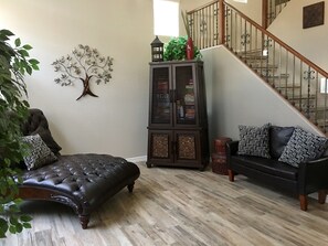 Peaceful sitting room with leather chaise lounge