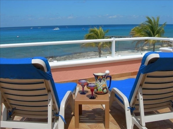 Relaxing with margaritas on the terrace, watching the dive boats drift by.