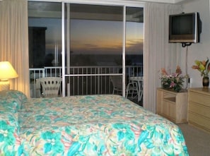 Watch the sunset and listen to the surf from your deluxe bed