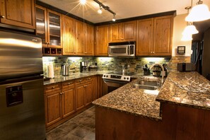 Your own deluxe kitchen with granite counter tops and stainless steel appliances