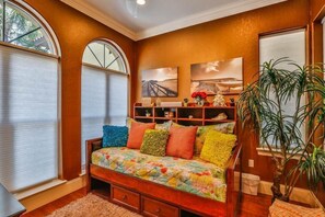 Den/Bedroom with twin size mattress and storage below.