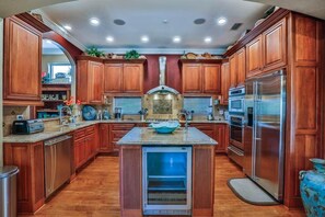 Kitchen with separate glass door drinks fridge.