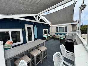OutdoorRoom!  Shady deck with ocean breeze and abundant dining space.