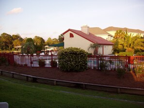 View of pool and clubhouse from back porch