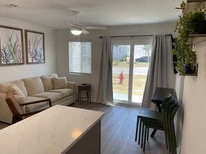 Living room with sliding glass door leading to the gulf