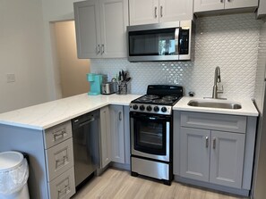 Kitchen with appliances and all kitchenware needs