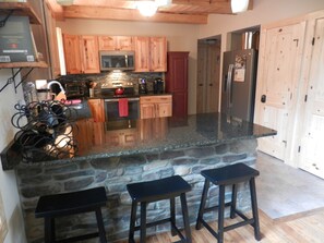 The granite counters provide plenty of room for seating and cooking