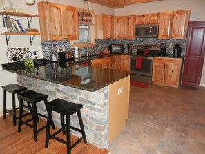 The kitchen is spacious and equipped to handle 14 people. Everything is new