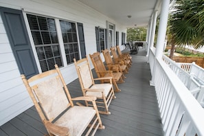 Plenty of rocking chairs line this extra large front porch.