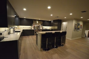 gourmet kitchen with 48" Wolf stove and SubZero fridge/freezer & soft ice maker