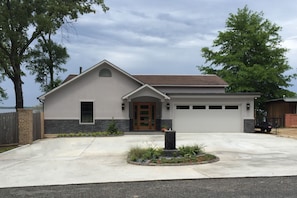 two car garage and lots of paved parking