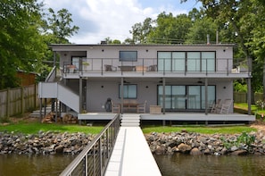 two deck levels face lake, lower has outdoor shower with hot & cold...