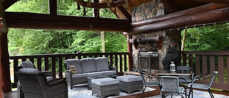 Outdoor Living room with wood burning fireplace