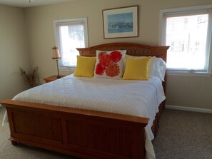 Large bedroom with King Size bed. Bright and airy with a closet and dresser.