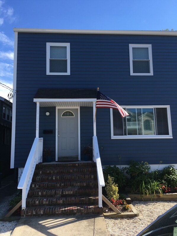 Beach House front view looking at 2 of 3 floors.  New windows & siding.