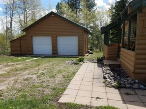 Garage stores the BBQ, propane firepit and chairs for the firepit