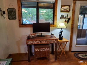 Dining room desk with monitor for touching in with work