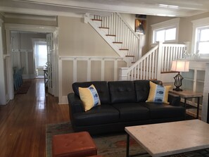 Staircase to upstairs, french doors to dining room