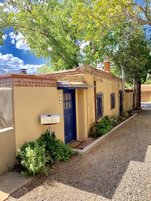Side/alley entrance into home. 
Two parking spots available with our property 