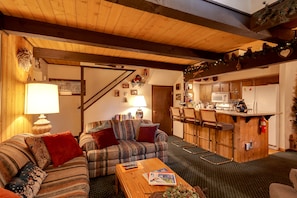 Living Room towards Breakfast Bar / Kitchen & Stairs