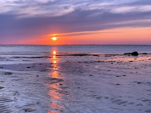 During sunset at low tide, our beach is a very special place.