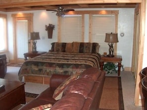 Room with king size bed, pocket doors, private jacuzzi bath and balcony
