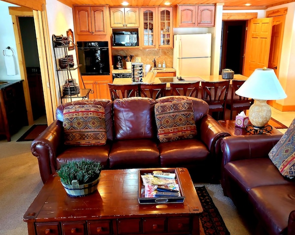 Family room/kitchen with king size bed with pocket doors and bath to the left