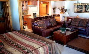 Great Room - family, kitchen and dining combined. King size bed with pocket door