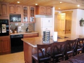 Spacious kitchen with bar stools