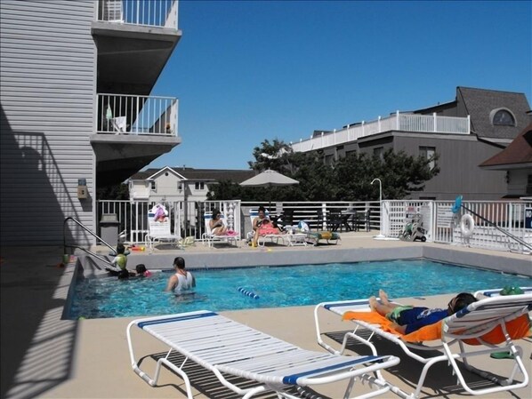 Ocean side view of Balconies, Pool deck & Garage