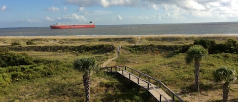 Balcony view! Beach front! Watch the ships come in and out every day!